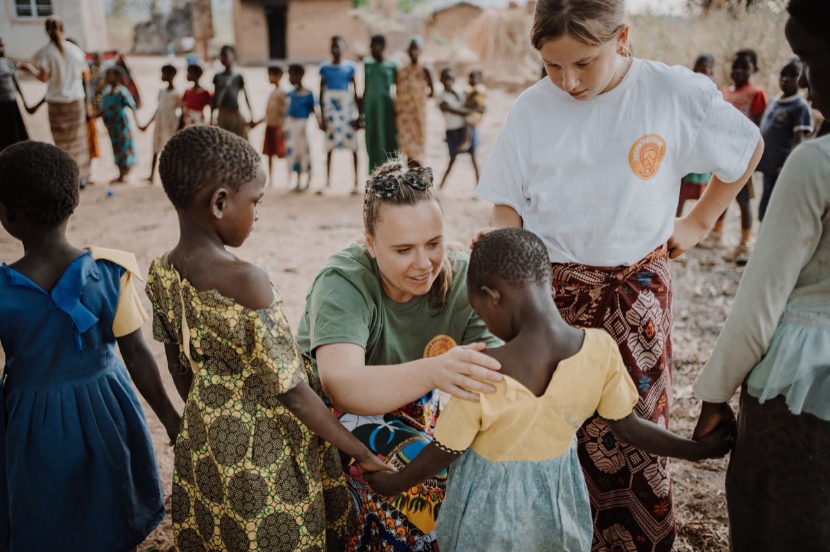 Playing circle games with village children