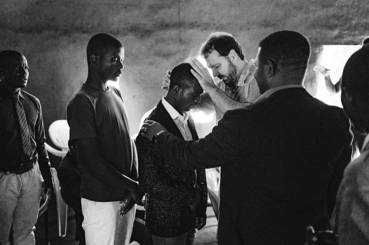 Laying on of hands in prayer